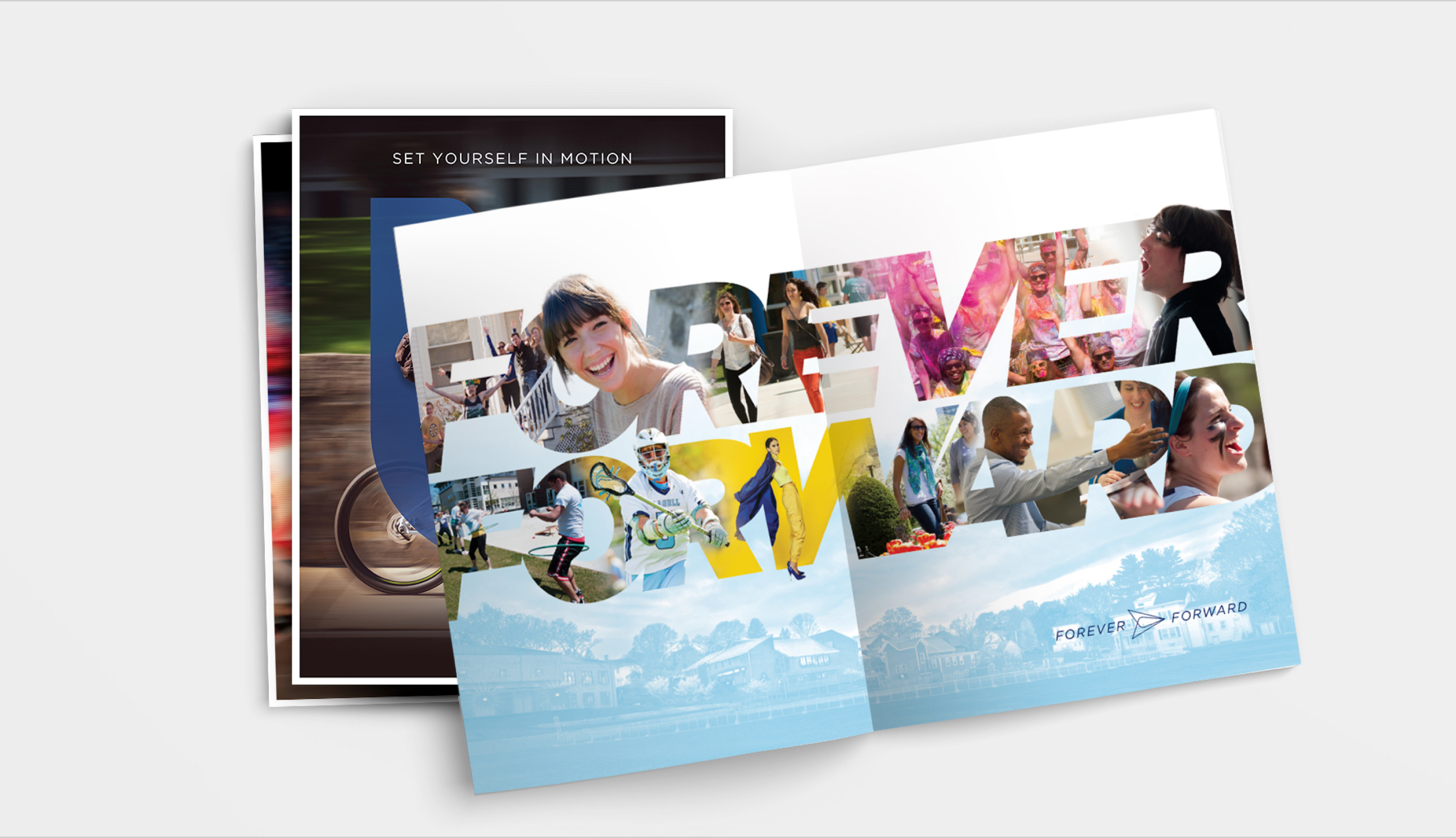 Open spread of view books with new Lasell University branding and Forever Forward message.